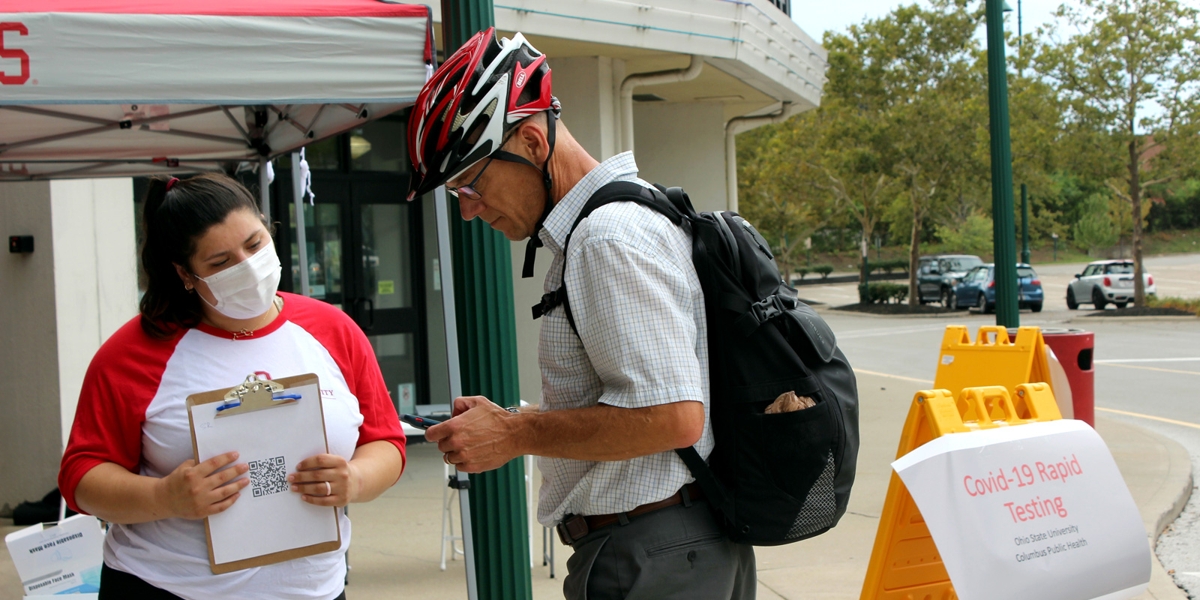 person helping community member with appointment
